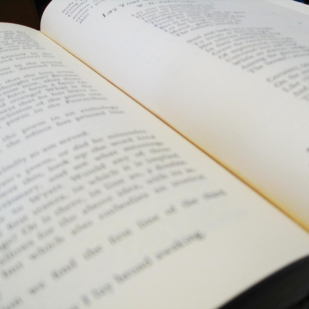 Close view of an open book of poetry