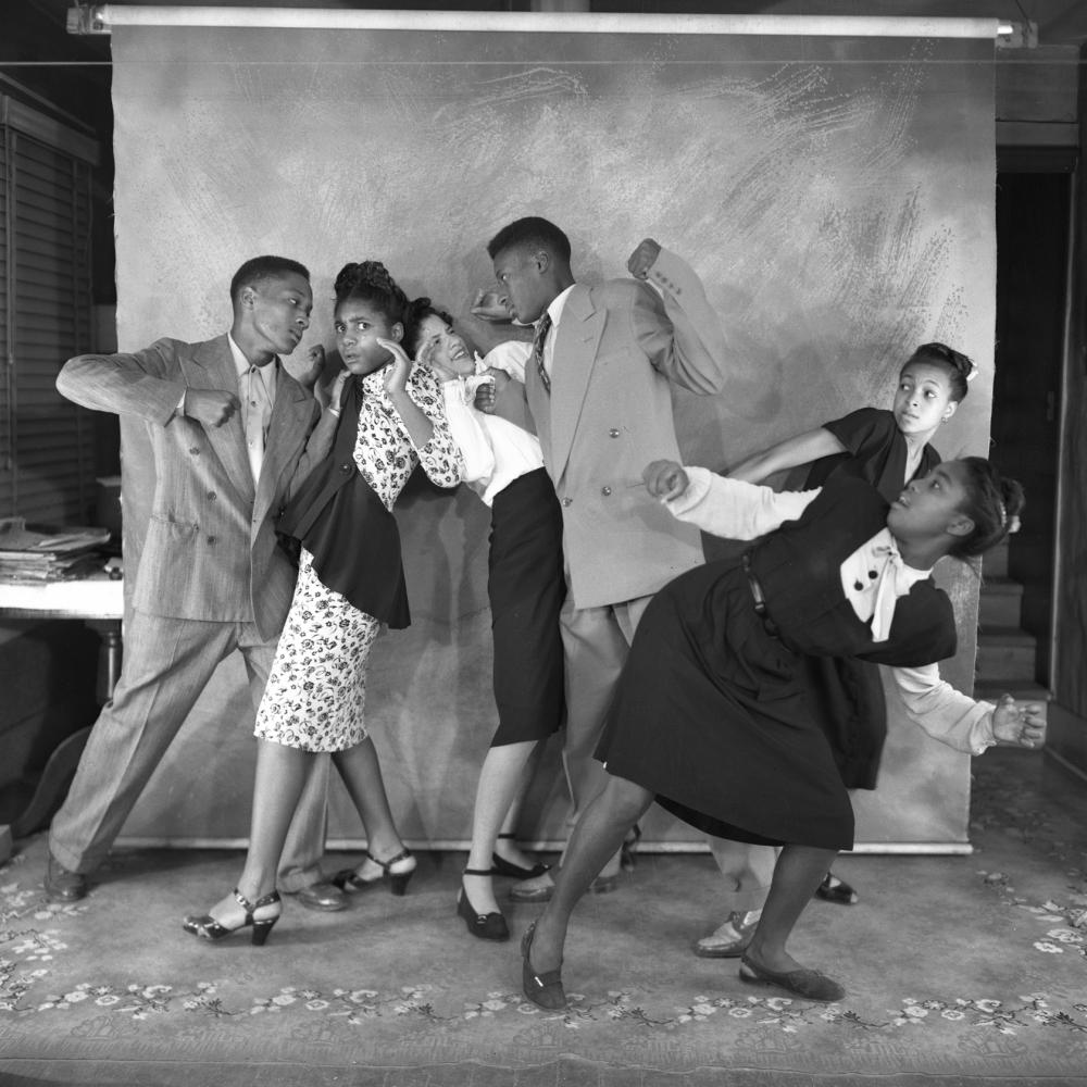 Black and white photo of several African Americans performing as pantomimes.