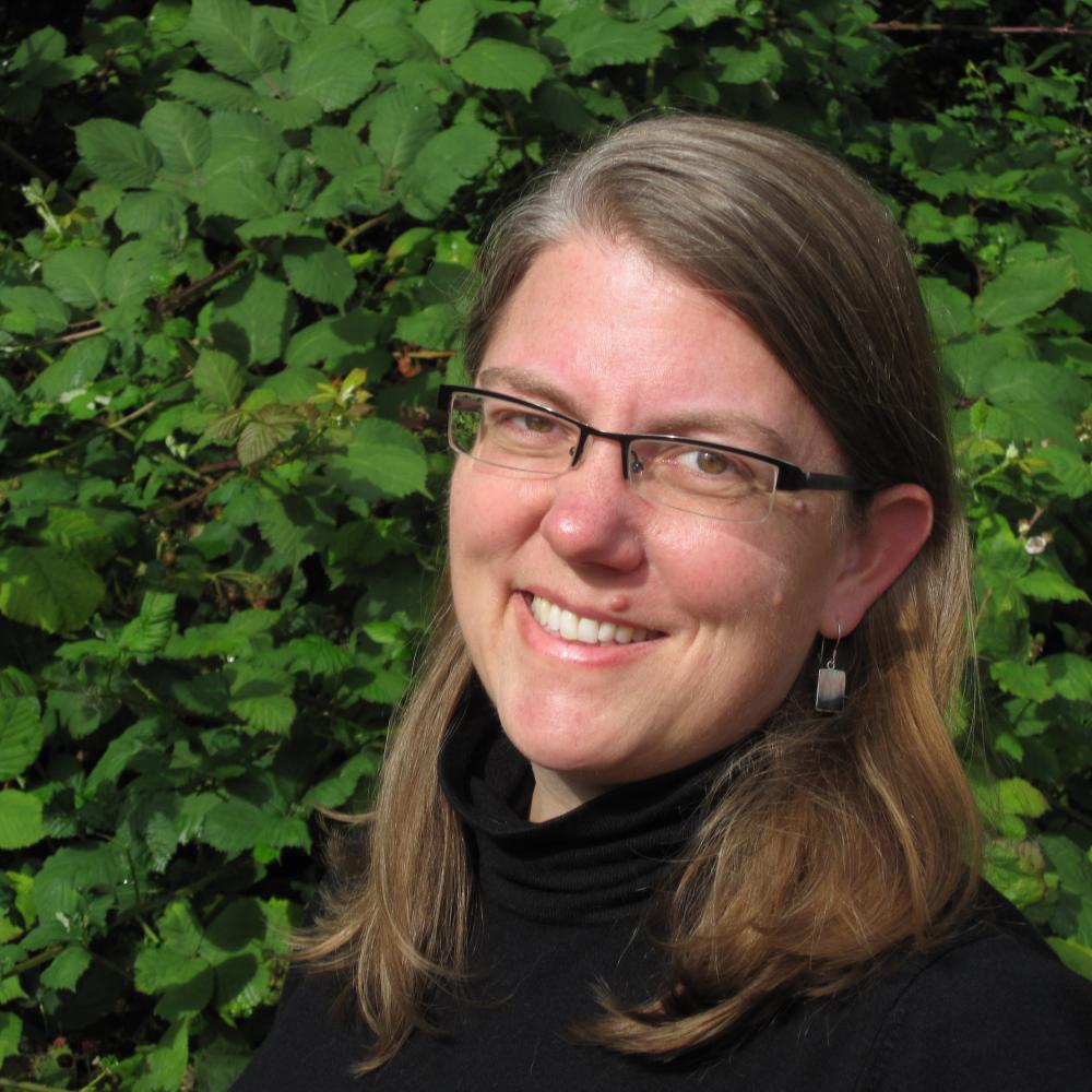 Color profile photo of Christina Barr wearing a black turtleneck
