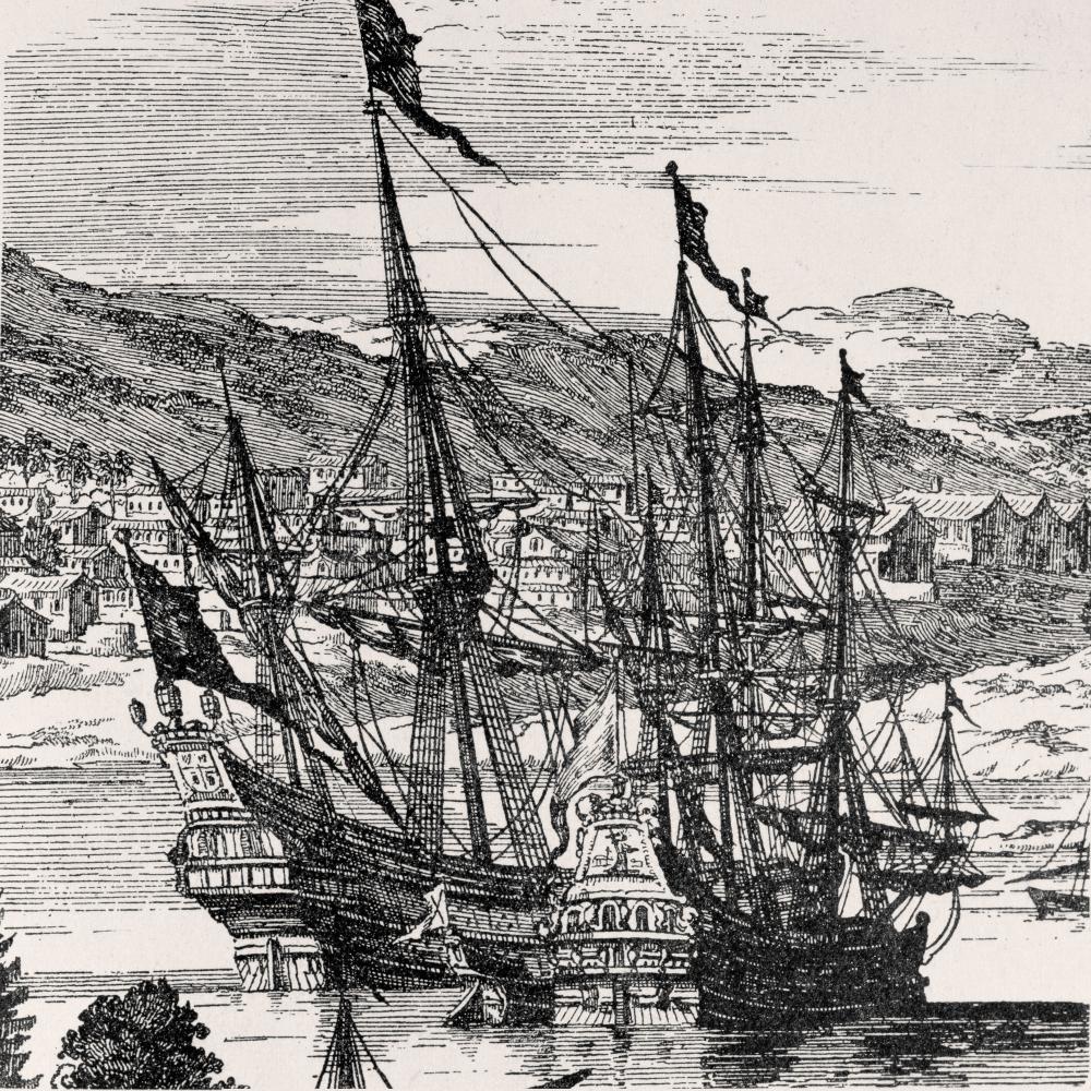 Drawing of two Spanish frigates sailing in front of a small coastal settlement. 