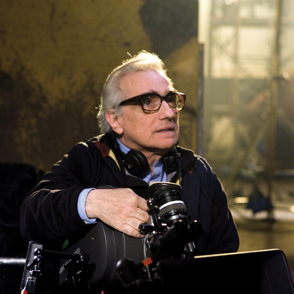 Photograph of martin scorsese with headphones around neck