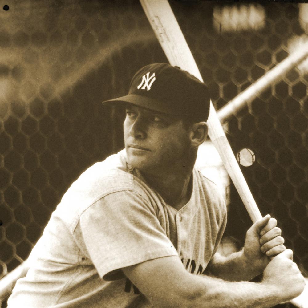Mantle at bat, ready to swing, wearing a New York Yankees cap