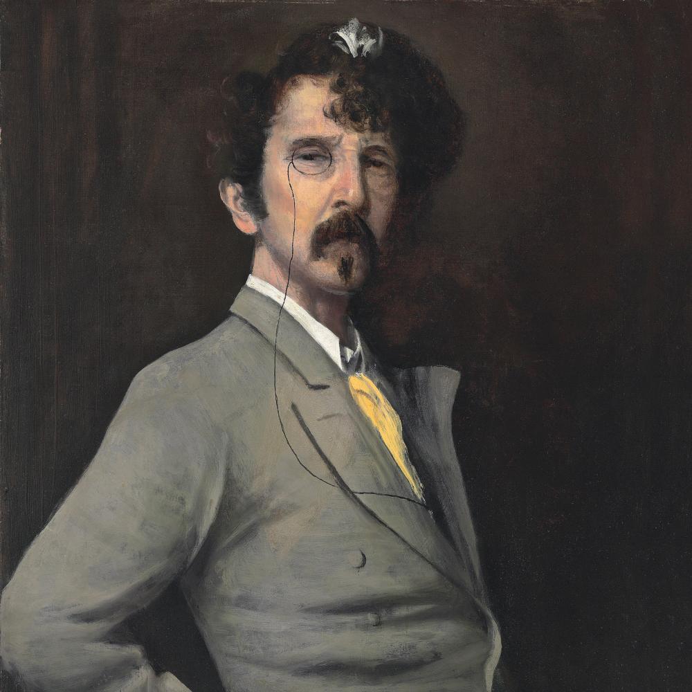 James Abbott McNeill Whistler in a grey suit and yellow tie, hand on his hip