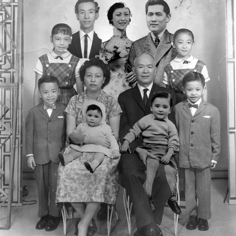 Black and white photo portrait of a Chinese family.
