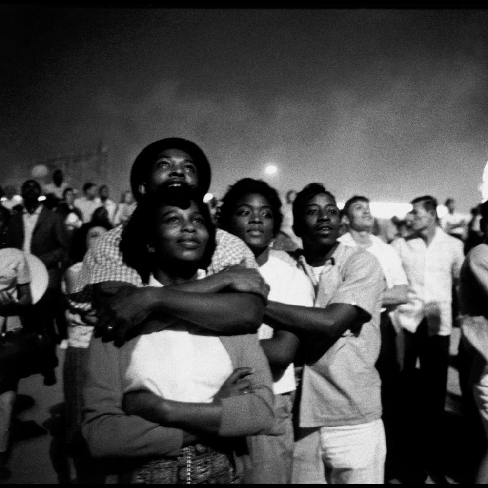 Coney Island crowd, with the ferris wheel in the background