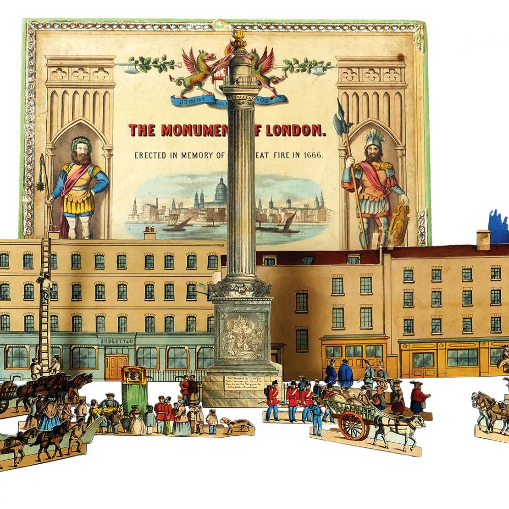 Color photo of a toy set of the Monument of London, including figurines and a building.