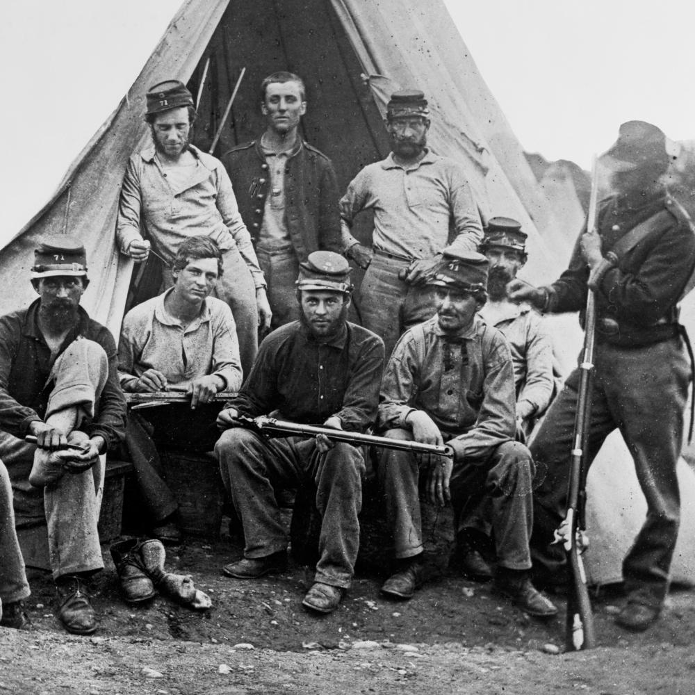 Black and white image of Union soldiers assembled for a group photo.