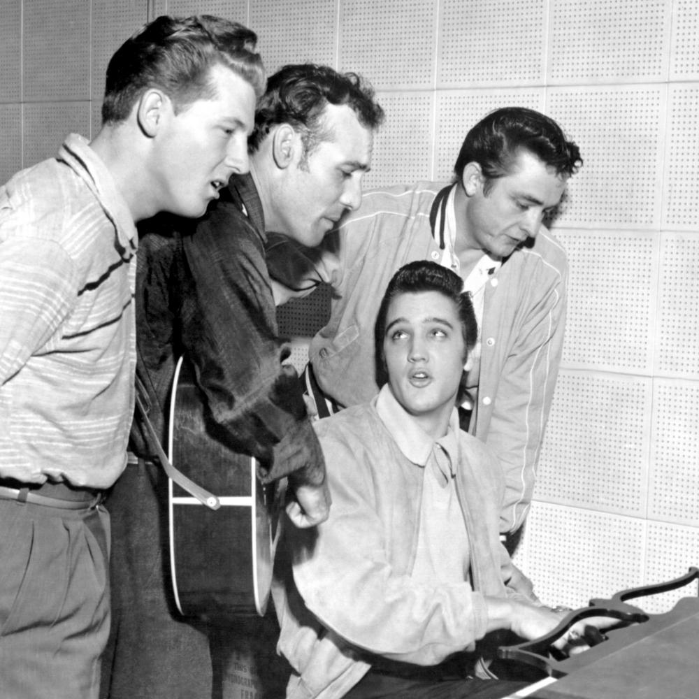 Jerry Lee Lewis, Carl Perkins, Elvis Presley and Johnny Cash singing, while Elvis plays the piano