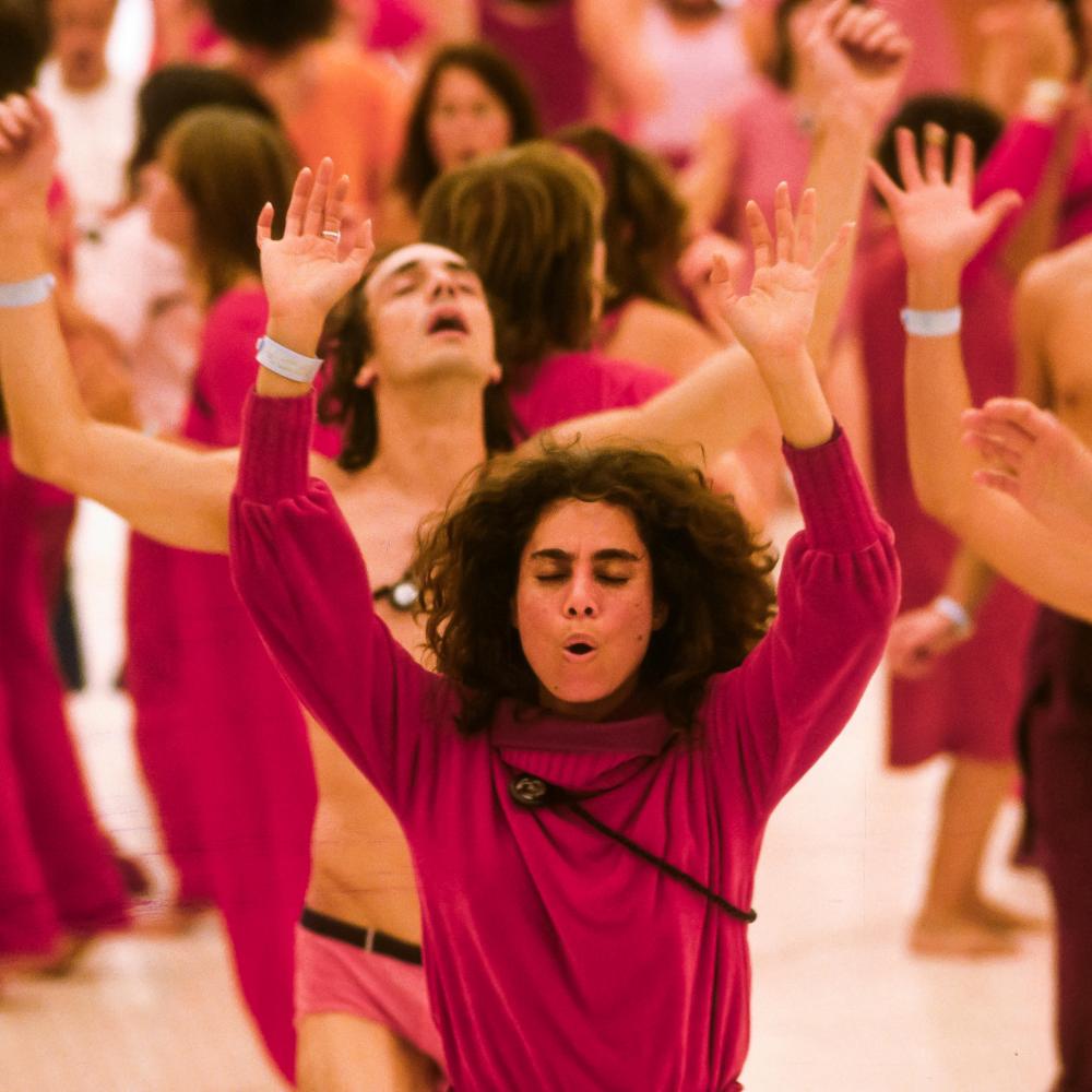 Rajneeshees, followers of Bhagwan Shree Rajneesh, participate in a Dynamic Meditation in 1982.