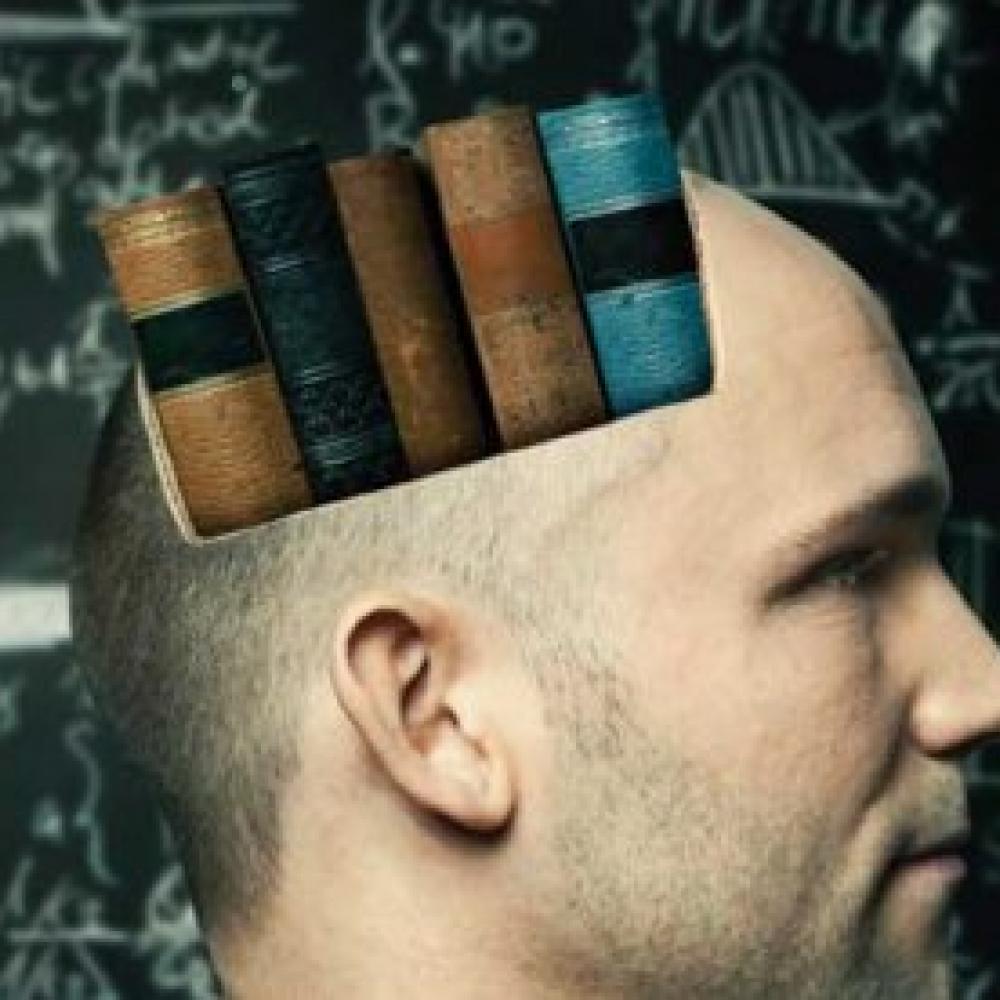 Man in profile with spine-out books superimposed on his head.