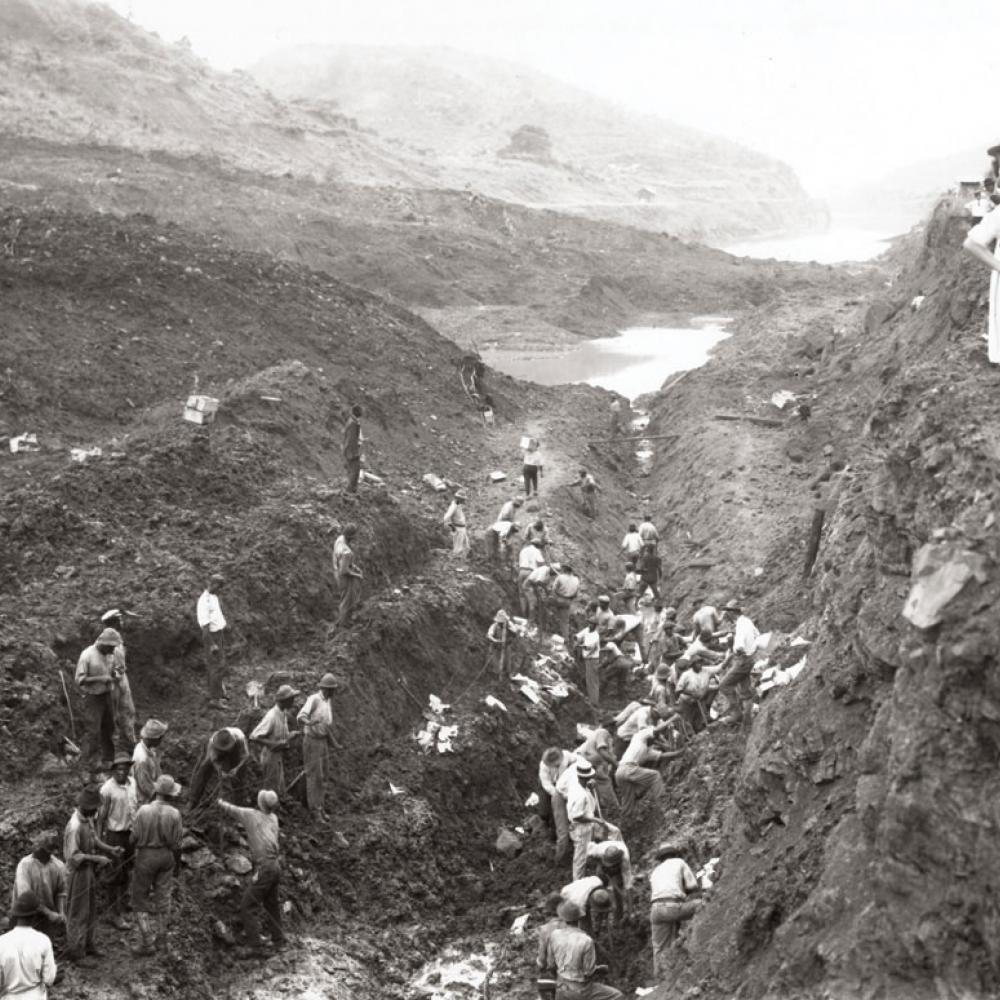 Black and white photo of men working on the Panama Canal.