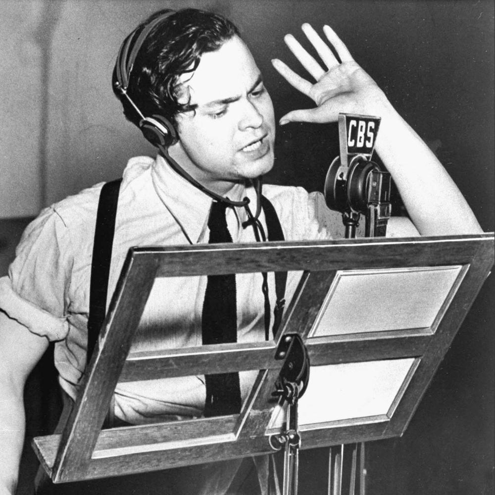 Orson Welles at microphone