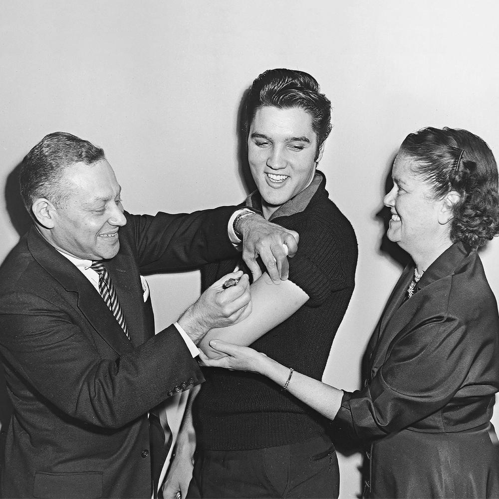 Elvis Presley receiving the polio vaccine. 