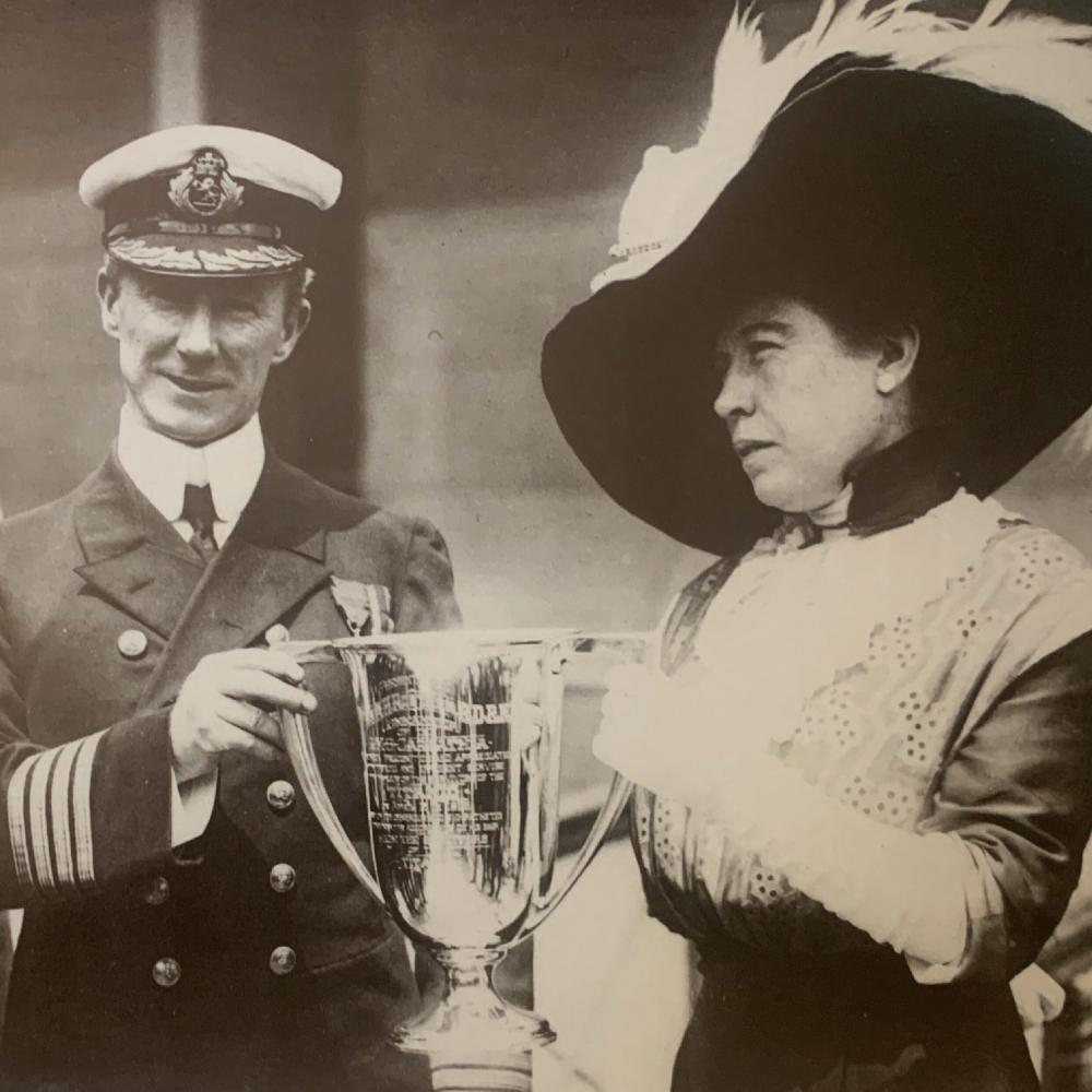 Brown presents a loving cup to A. H. Rostron, captain of the RMS Carpathia, to commemorate his rescue of the Titanic's survivors.