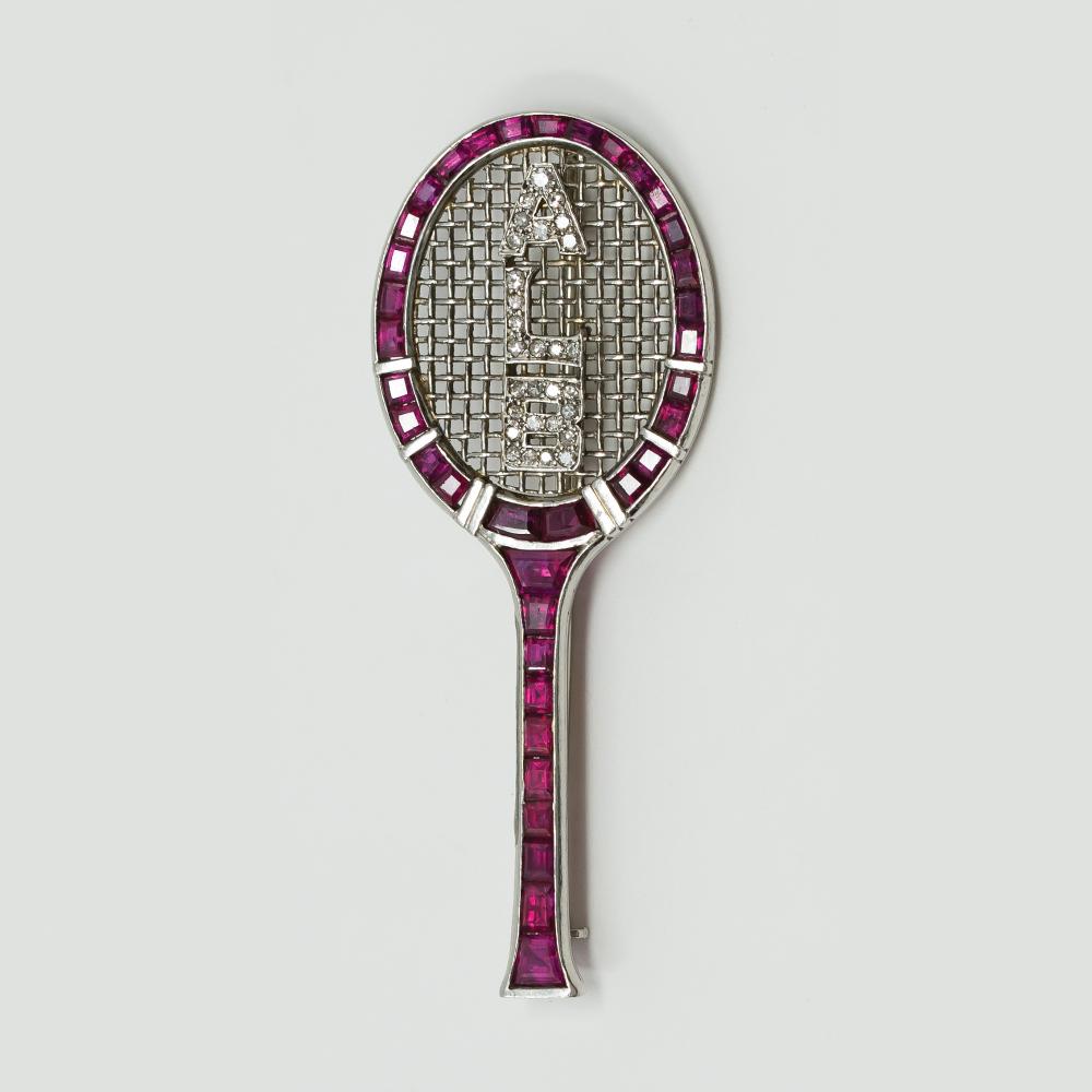 Ruby-and-diamond tennis racket brooch