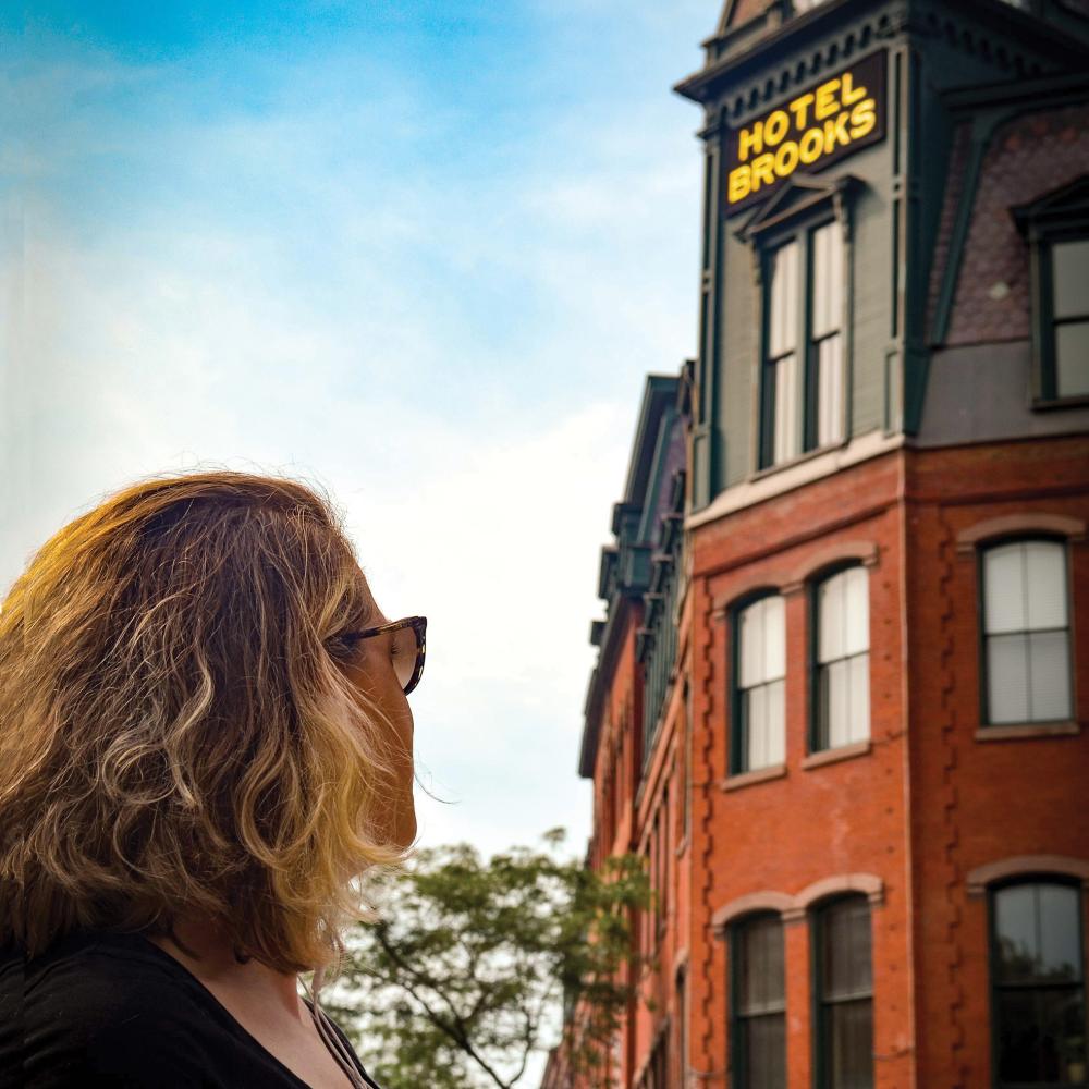 Woman in front of Brattleboro's Hotel Brooks.