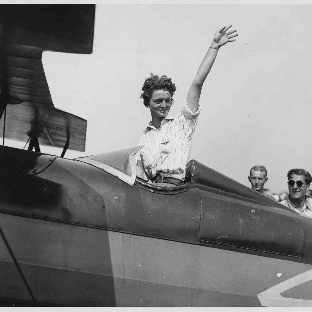 Pilot Louise Thaden waving from her airplane