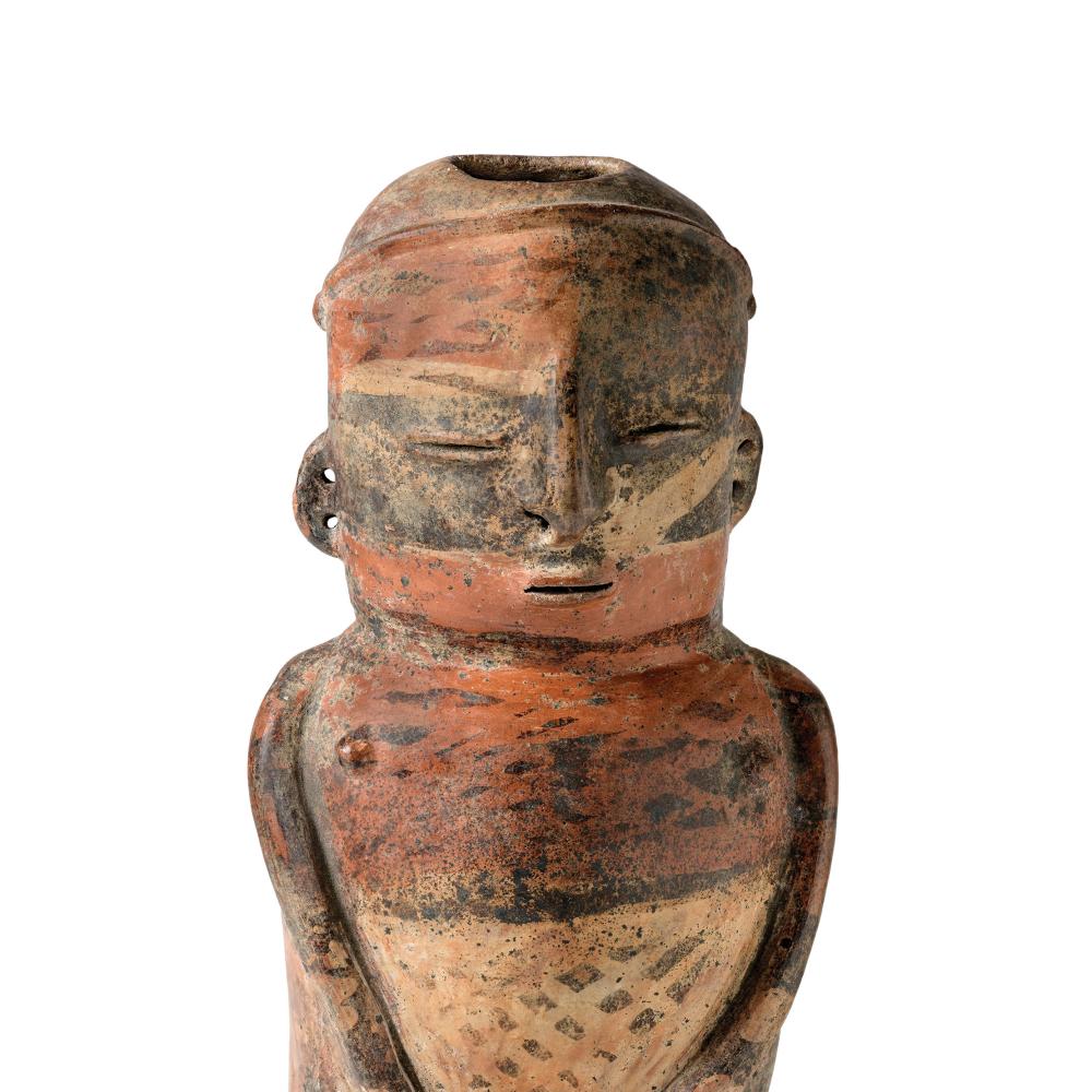 Ceramic vessel from ancient Colombia depicts a man in deep thought