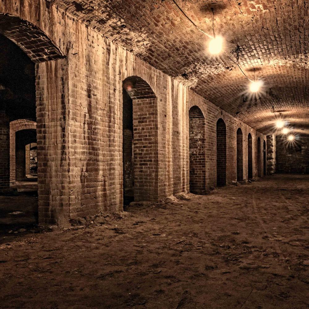 photograph of the dimly lit catacombs underneath Indianapolis