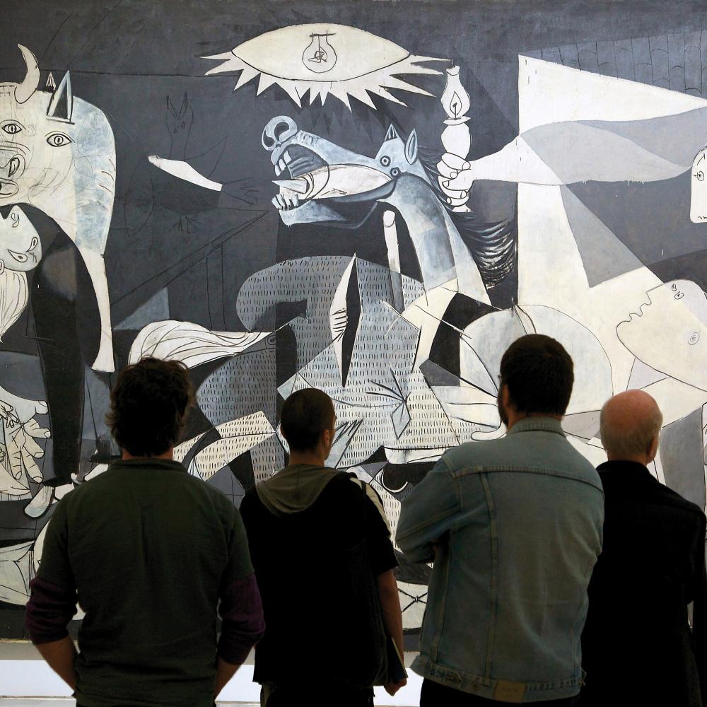 Group of people looking at Picasso's Guernica