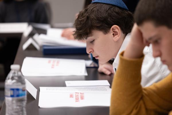 photograph of student reading booklet 