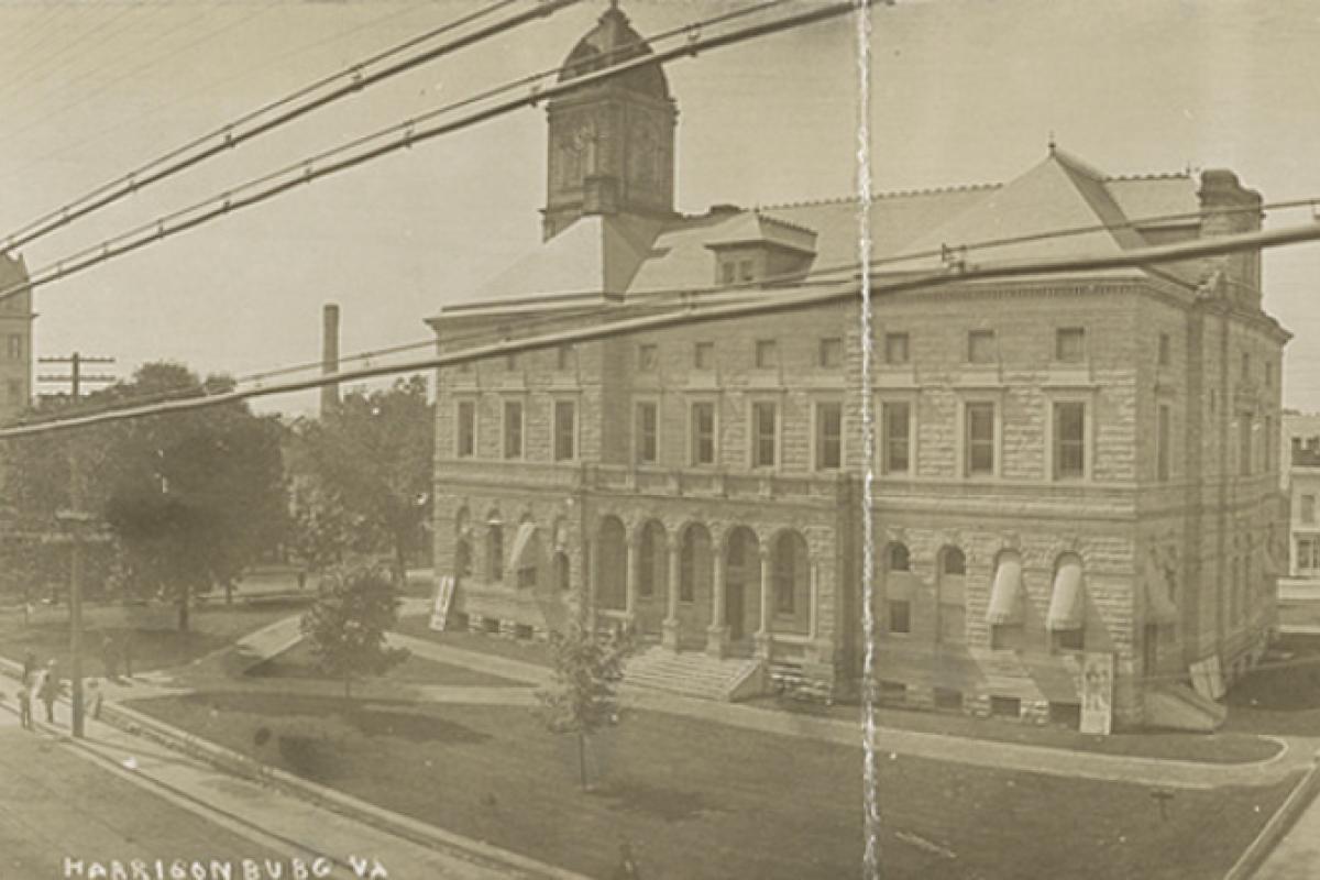 Postcard showing Rockingham County courthouse and surrounding buildings in Harrisonburg, Virginia.