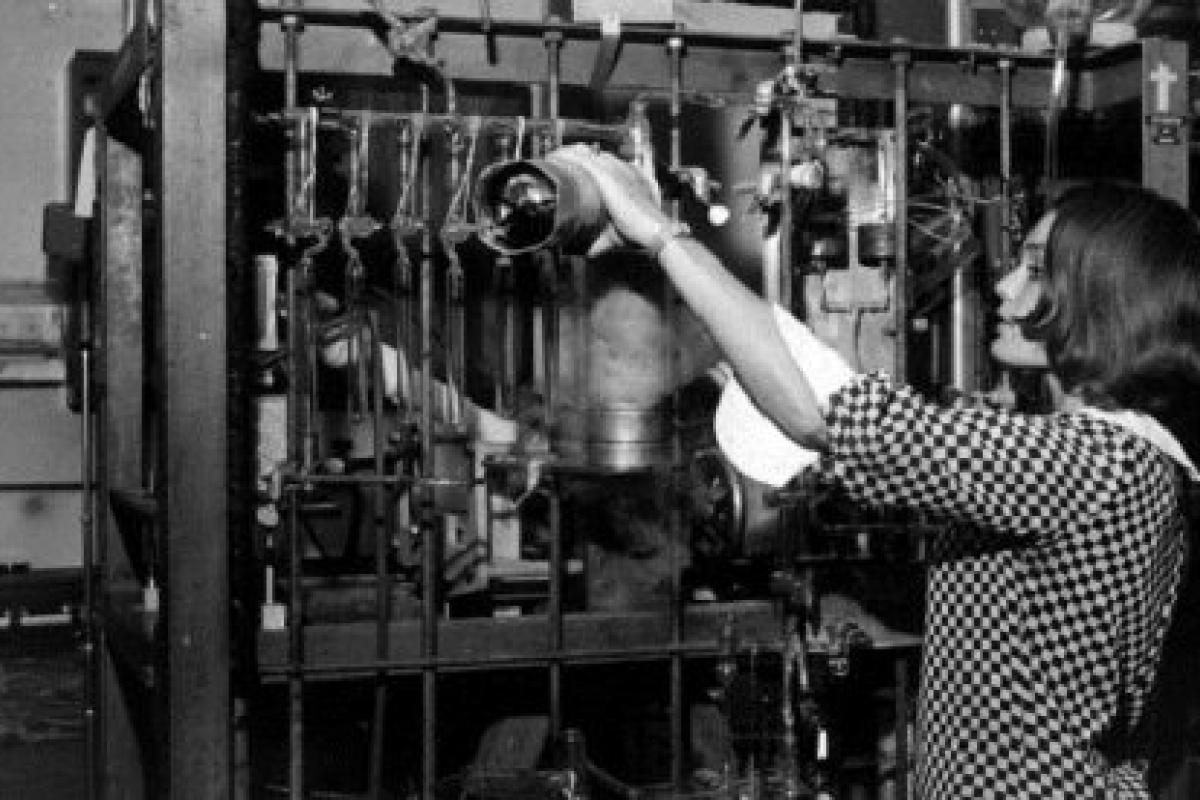 Young woman working with scientific equipment.