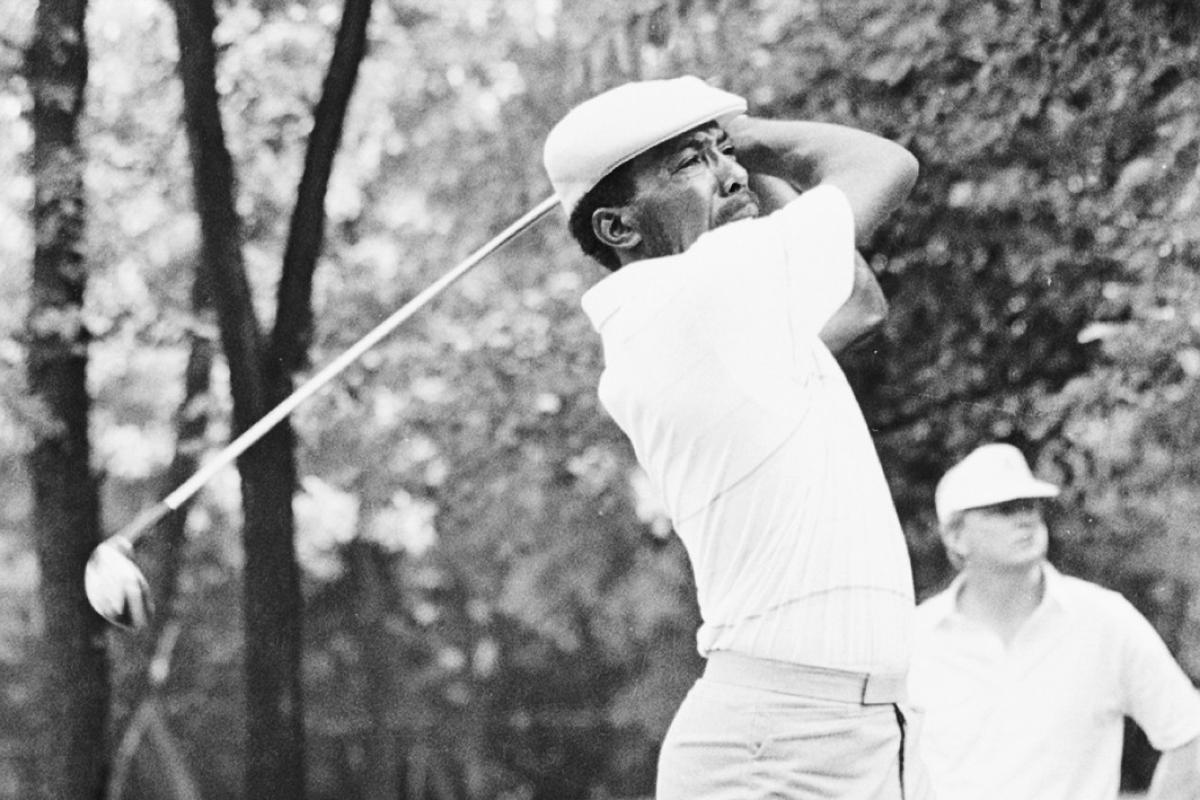Black and white image of Calvin Peete swinging golf club