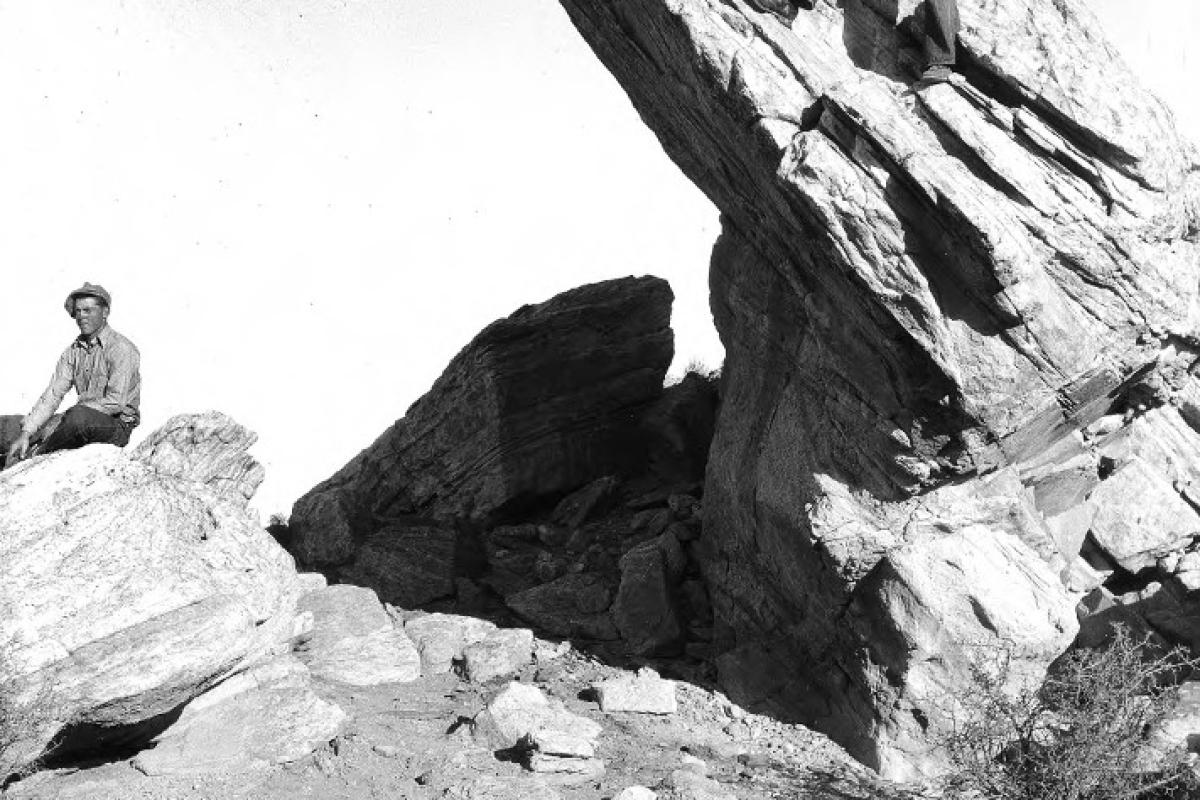 Two men climbing rock formations