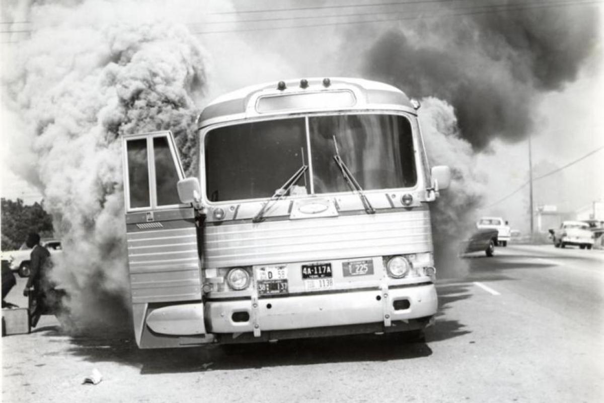 photo: firebombed Freedom Ride bus in Annison, Alabama, May 14, 1961