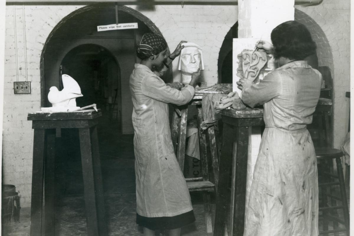 Two women working in sculpture studio at Wellesley College