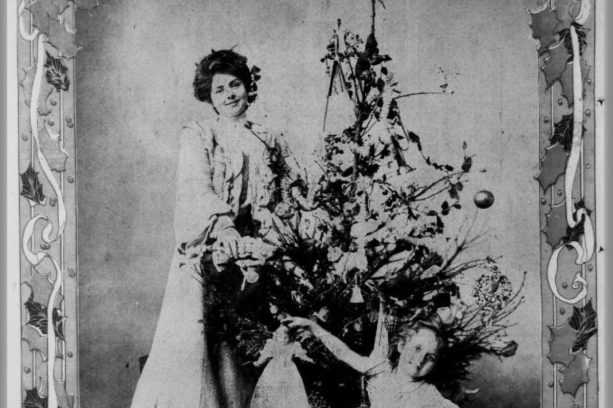 Woman and child by Christmas tree