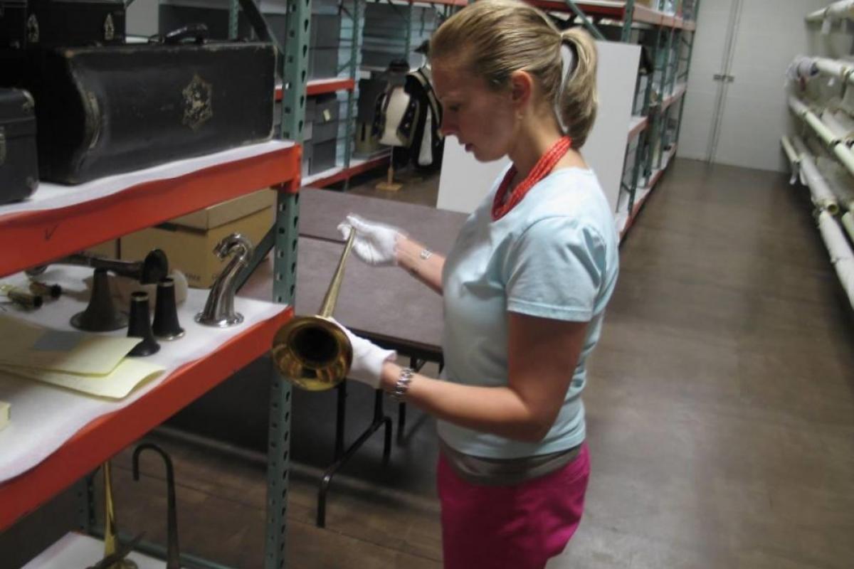 Girl holding musical instrument