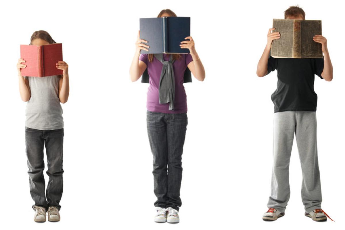 photo: three kids holding books