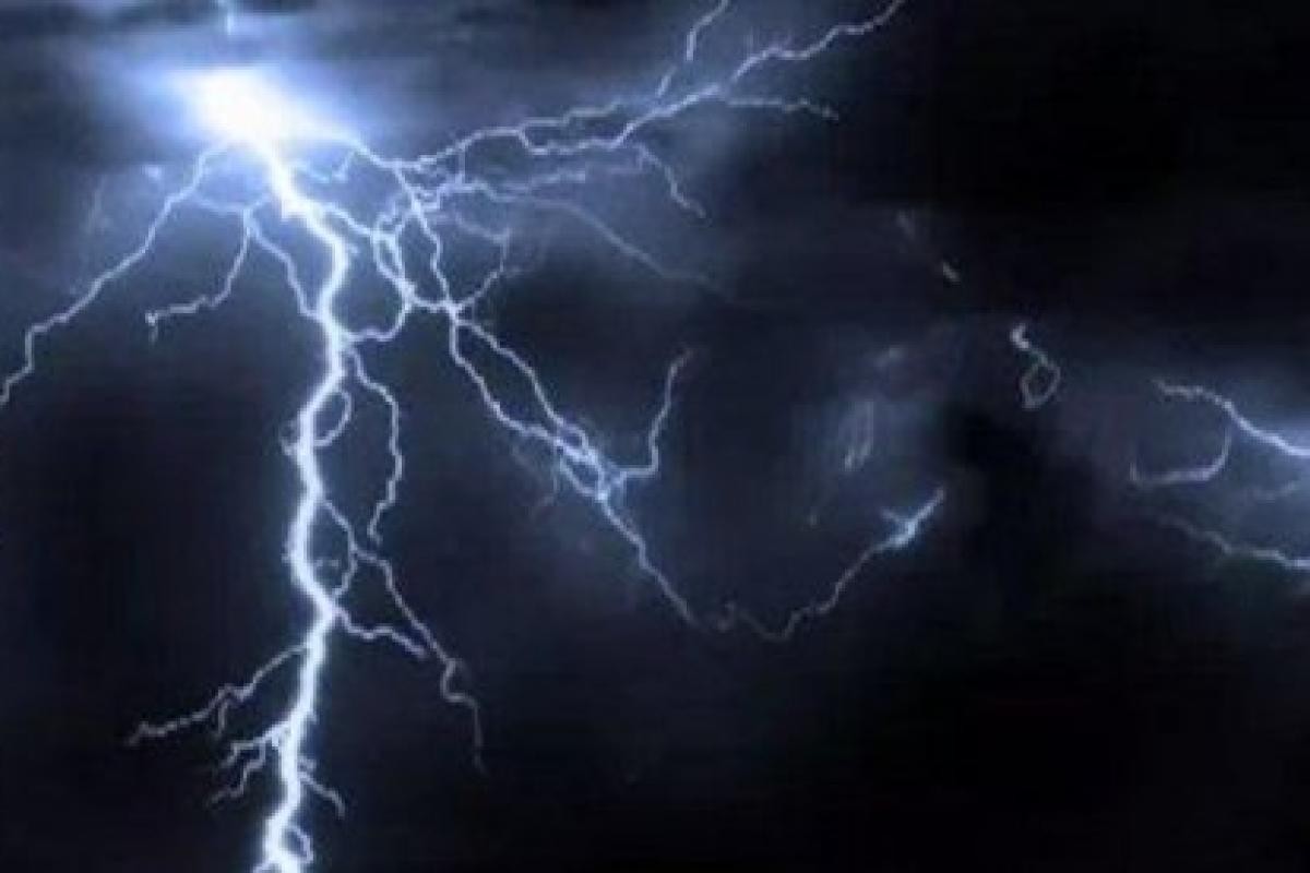 Picture of a lightning bolt striking from the sky over a dark background.