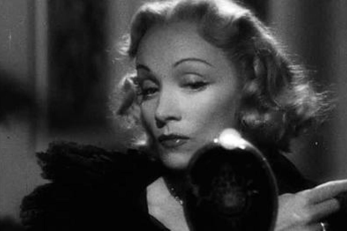 A black and white still of Marlene Dietrich in Stage Fright