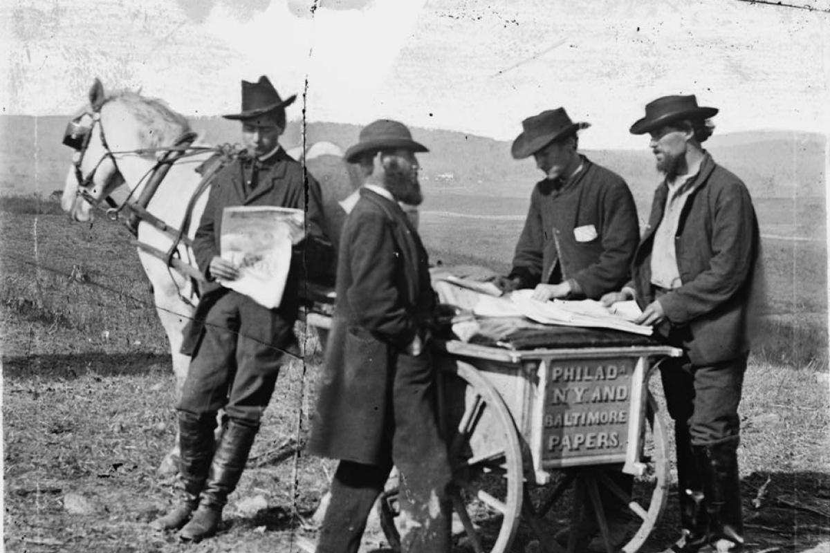 Newspaper vendor and cart in camp in Virginia, 1863