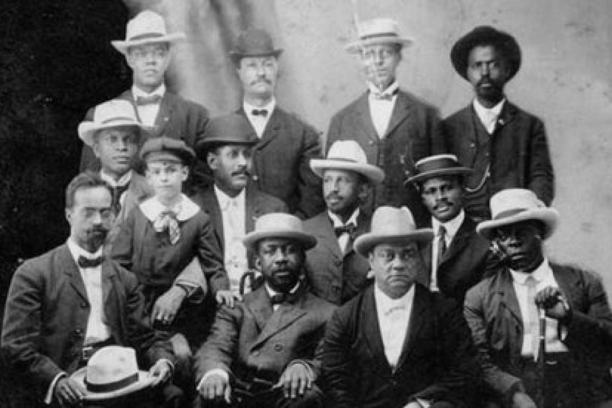 Members of the Niagara Movement, against a background of Niagara Falls