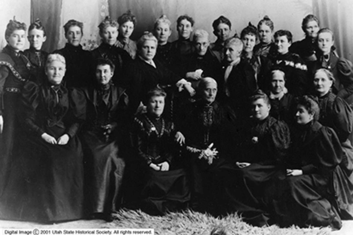 Utah suffrage leaders, including Martha Cannon, Emily S. Richards, Sarah Kimball, Emmeline B. Wells, Zina D. Young, along with Colorado suffrage leaders Mary C. C. Bradford and Lyle Meredith Stansbury, accompany Susan B. Anthony and Rev. Anne Howard Shaw.