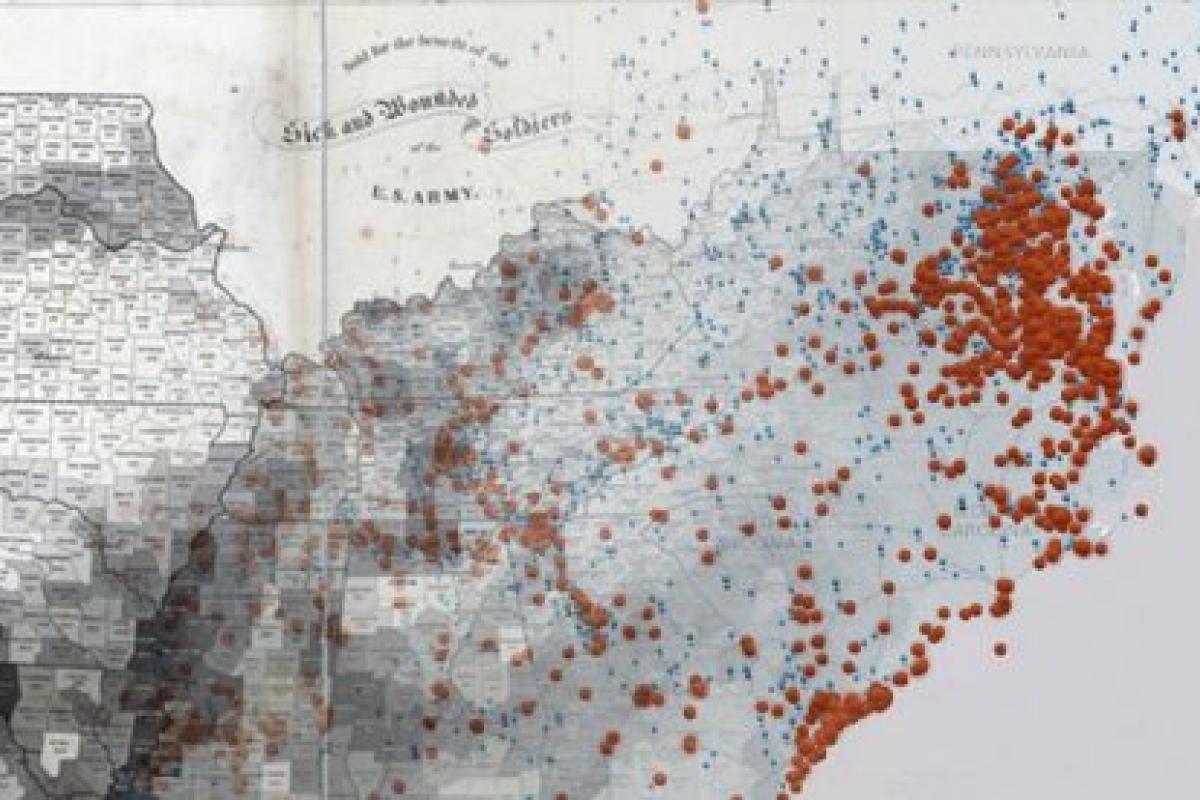 A grayscale map of the American South with red dots indicating the size of the slave population in various towns / cities.