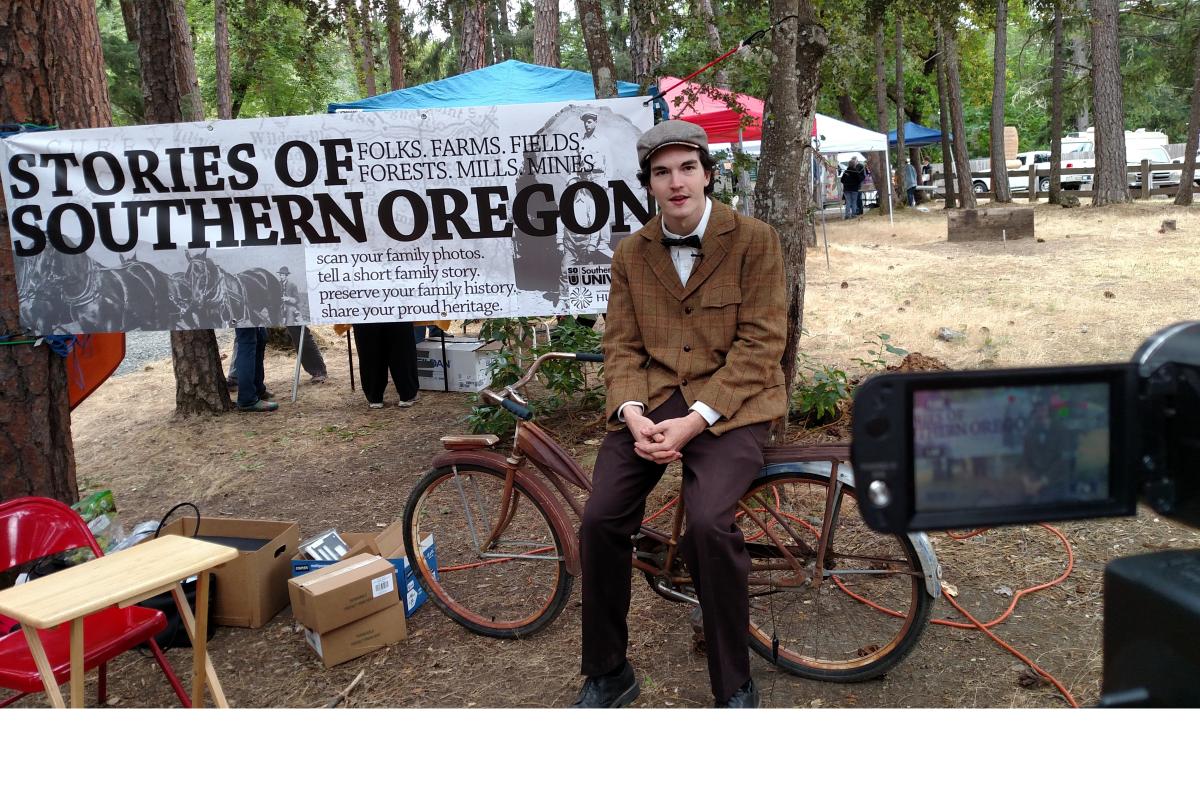 Photograph of man sitting on bicycle