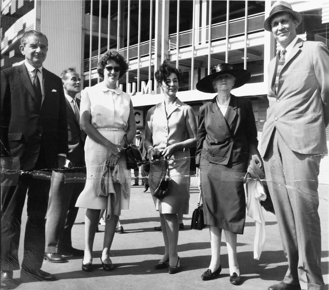 unidentified man (standing back) Monroe Wheeler, Ann Laughlin, Gertrude Vanderbilt Whitney, Marianne Moore, and James Laughlin standing outside Shea Stadium in Queens for a New York Mets baseball game.