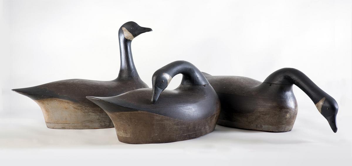 three wooden ducks