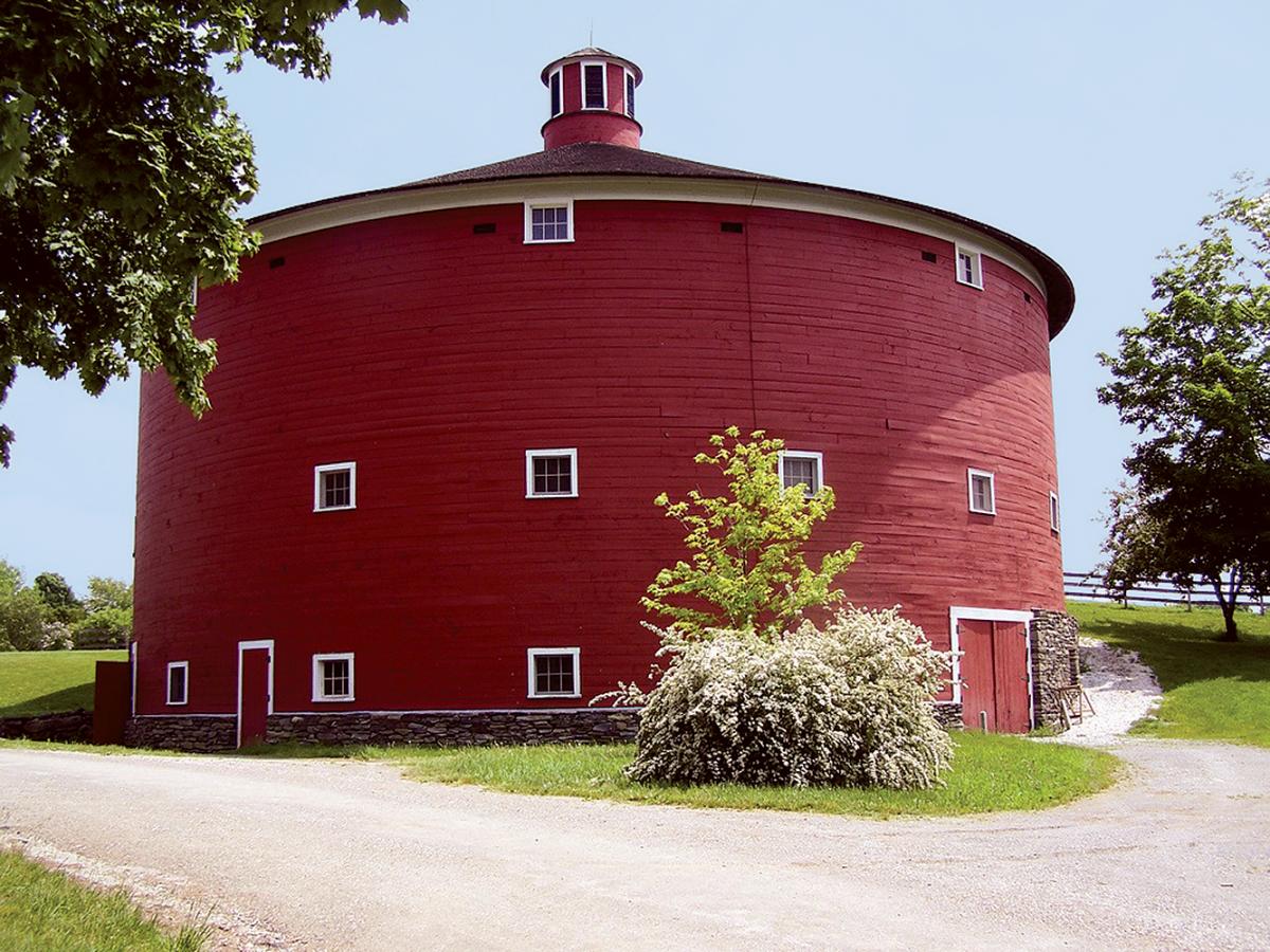 Photograph of a round, red barn