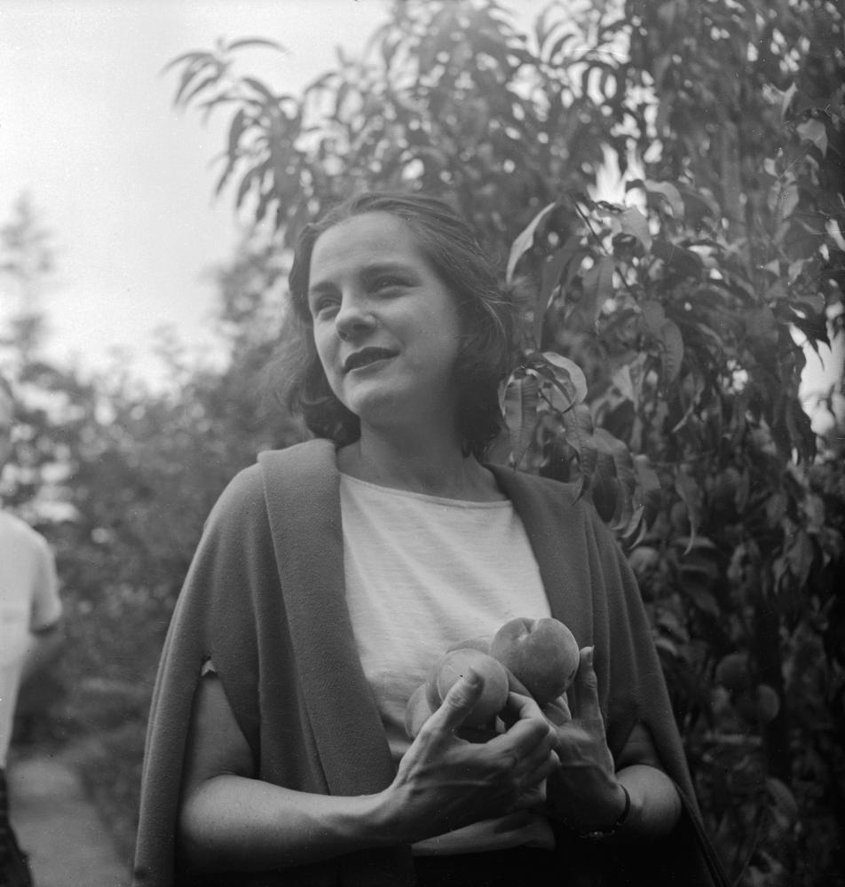 Black and white photograph of a woman in a shawl