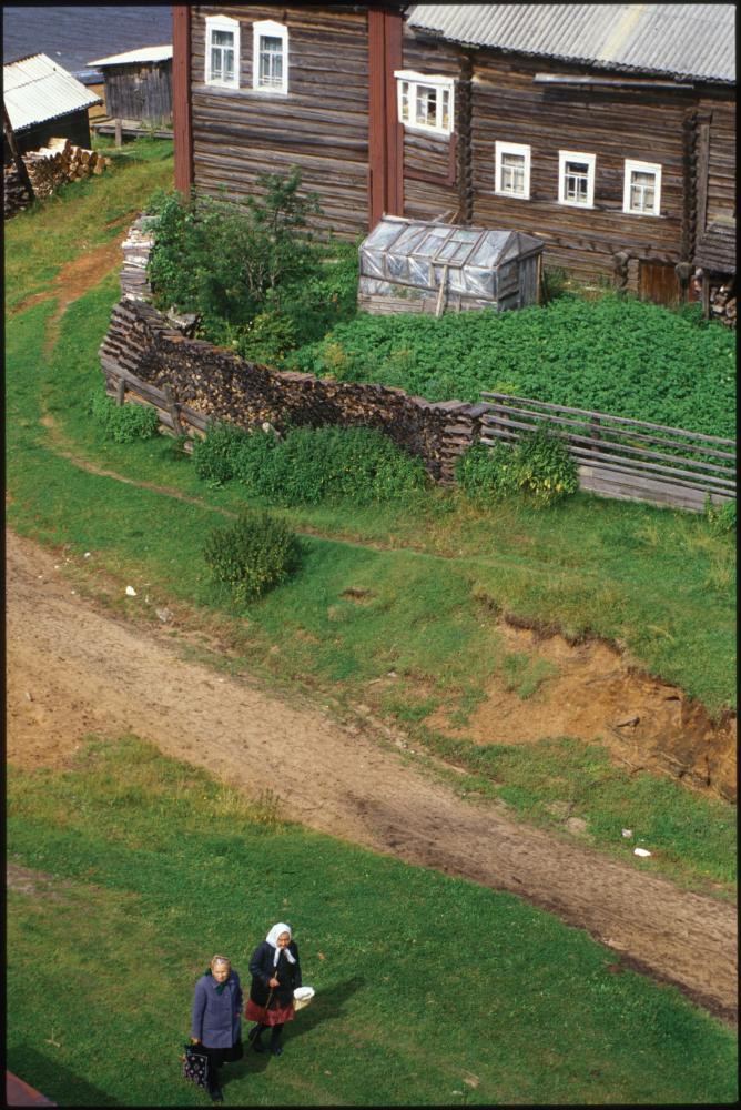 photograph looking down at a wooden fence