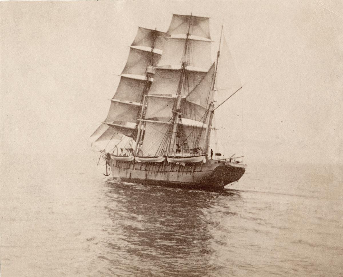 Black and white photograph of a ship at sea