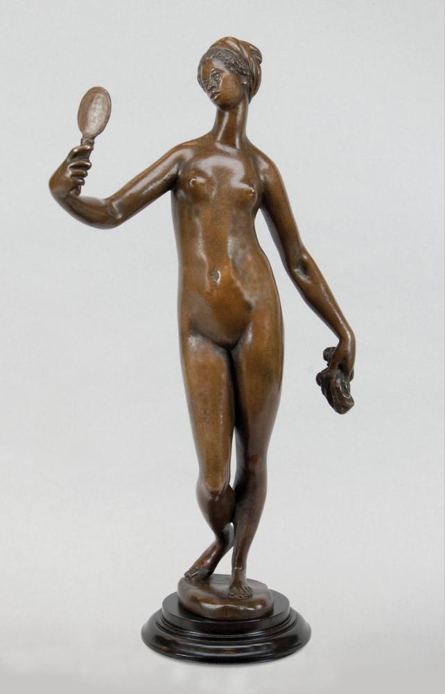 Bronze colored sculpture of a woman looking at herself in a hand-held mirror