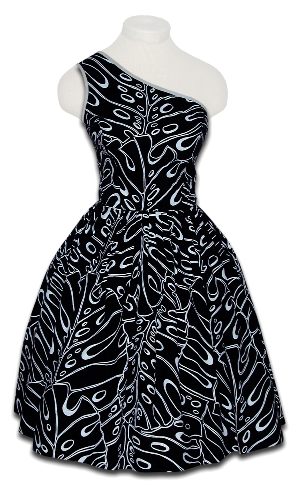 Black, one shouldered dress with a pattern of white monstera leaves