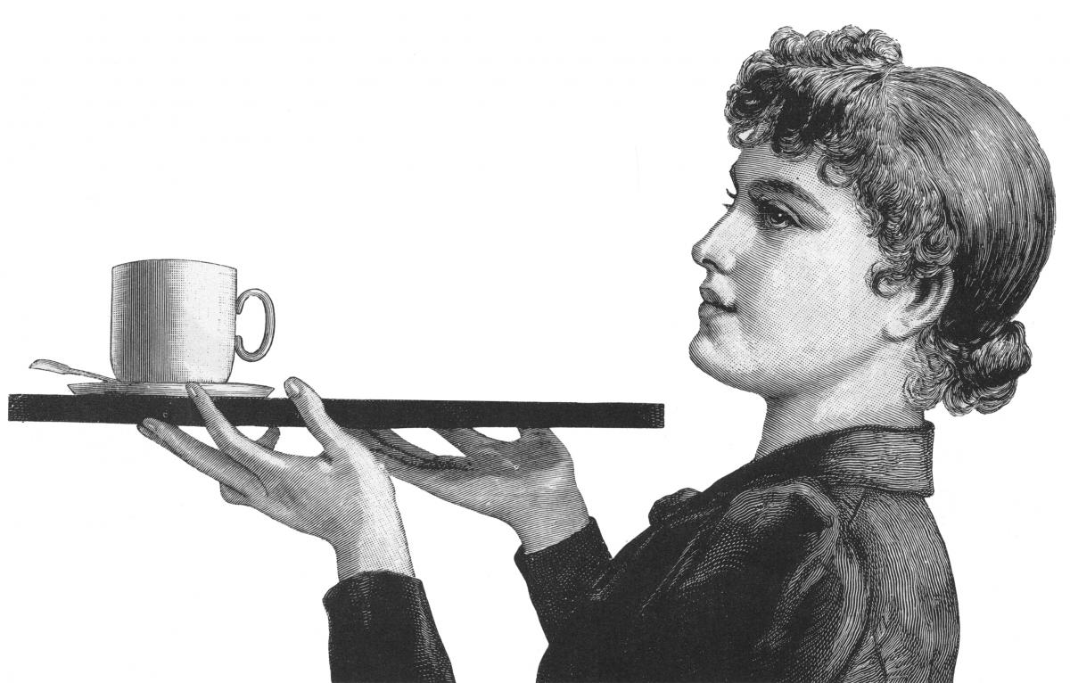 Woman carrying a tray with a coffee cup and saucer on it